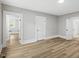 Spacious bedroom with hardwood floors and neutral paint, enhanced by natural light at 205 Forest Hill Ave, Rocky Mount, NC 27804
