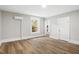 Bright bedroom with hardwood floors, fresh paint, and natural light from the window at 205 Forest Hill Ave, Rocky Mount, NC 27804