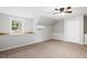 Spacious bedroom features neutral paint, carpet, window and ceiling fan at 205 Forest Hill Ave, Rocky Mount, NC 27804