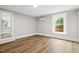 Bedroom features sleek flooring and an air conditioning unit at 205 Forest Hill Ave, Rocky Mount, NC 27804