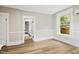 Bright bedroom with hardwood floors, natural light, and updated trim at 205 Forest Hill Ave, Rocky Mount, NC 27804