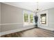Spacious dining room featuring hardwood floors, a modern chandelier, and neutral paint at 205 Forest Hill Ave, Rocky Mount, NC 27804