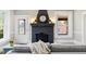 Close up of living room fireplace featuring a large black mantel with decor at 205 Forest Hill Ave, Rocky Mount, NC 27804