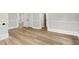 Hallway featuring hardwood floors, white trim, and a series of doorways at 205 Forest Hill Ave, Rocky Mount, NC 27804