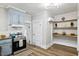 Kitchen includes stainless steel appliances, granite countertop, and light blue cabinets at 205 Forest Hill Ave, Rocky Mount, NC 27804