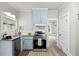 Kitchen includes stainless steel appliances, granite countertop, and light blue cabinets at 205 Forest Hill Ave, Rocky Mount, NC 27804