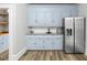 Kitchen includes stainless steel appliances, granite countertop, and light blue cabinets at 205 Forest Hill Ave, Rocky Mount, NC 27804