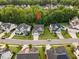 Charming two-story home with a manicured lawn and a tree-lined backyard in a beautiful neighborhood at 2083 Amalfi Pl, Apex, NC 27502