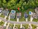 A bird's eye view of a home with an expansive backyard, and neighborhood amenities that include community pools at 2083 Amalfi Pl, Apex, NC 27502