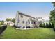 Great backyard featuring a patio with a table and chairs, and a screened-in porch at 2083 Amalfi Pl, Apex, NC 27502