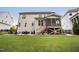 Outdoor patio and backyard featuring a screened-in porch with stairs at 2083 Amalfi Pl, Apex, NC 27502