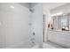 Bathroom featuring tiled shower and tub and vanity with white cabinets and granite counters at 2083 Amalfi Pl, Apex, NC 27502