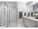 Stylish bathroom with a double vanity and glass-enclosed shower at 2083 Amalfi Pl, Apex, NC 27502