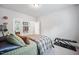 Neutral colored bedroom with carpet, queen bed, mirrored closet door and work out bench at 2083 Amalfi Pl, Apex, NC 27502