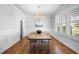 Elegant dining room with hardwood floors and wainscoting at 2083 Amalfi Pl, Apex, NC 27502