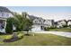 Charming home with a two-car garage and a meticulously landscaped front yard at 2083 Amalfi Pl, Apex, NC 27502