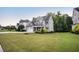 Beautiful two-story home with a well-manicured lawn and attached two car garage at 2083 Amalfi Pl, Apex, NC 27502