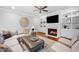 Cozy living room featuring a fireplace, TV, and comfortable seating at 2083 Amalfi Pl, Apex, NC 27502