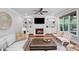 Inviting living room with a fireplace, built-in shelves, and plush furniture at 2083 Amalfi Pl, Apex, NC 27502