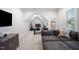 Angled view of a living room office space showing the couch, desk and chair at 2083 Amalfi Pl, Apex, NC 27502