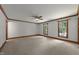 Spacious bedroom offering neutral carpet, large windows for natural light, and a ceiling fan at 221 Jansmith Ln, Raleigh, NC 27615