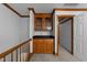 Hallway with a built in cabinet featuring a black countertop and access to additional storage at 221 Jansmith Ln, Raleigh, NC 27615