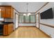 Cozy dining area with a bay window, modern lighting fixture, and ample natural light at 221 Jansmith Ln, Raleigh, NC 27615