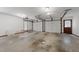 Large two car garage with neutral walls and natural light from window at 221 Jansmith Ln, Raleigh, NC 27615