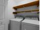Laundry room with storage shelves and washer dryer hookups ready for appliances at 221 Jansmith Ln, Raleigh, NC 27615