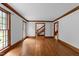 Open living area with hardwood floors, large windows, crown molding, and seamless transitions to other rooms at 221 Jansmith Ln, Raleigh, NC 27615