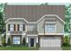 Charming two-story home with stone accents, attached garage, and well-manicured lawn and professional landscaping at 221 N Maple Walk Walk # 221, Garner, NC 27529