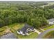 Sprawling home with a backyard, lush trees and neighboring homes at 2220 Inwood Landing Ct, Raleigh, NC 27603