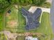 Aerial view of home with large backyard, bordered by trees, features outdoor space at 2220 Inwood Landing Ct, Raleigh, NC 27603