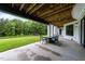 Lovely covered back porch with seating area overlooking a spacious backyard at 2220 Inwood Landing Ct, Raleigh, NC 27603