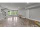 Spacious finished basement with windows and door to an outdoor patio space with access to the backyard at 2220 Inwood Landing Ct, Raleigh, NC 27603