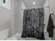 Cozy bathroom features a shower with stylish curtain and neutral wall paint at 2220 Inwood Landing Ct, Raleigh, NC 27603