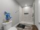 Modern bathroom with a glass enclosed shower, updated fixtures, and tiled walls with a built-in shelf at 2220 Inwood Landing Ct, Raleigh, NC 27603