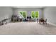 Large bonus room with natural light, play areas, and neutral carpet at 2220 Inwood Landing Ct, Raleigh, NC 27603