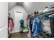 Walk-in closet with hanging rods, shelving, and ample storage space at 2220 Inwood Landing Ct, Raleigh, NC 27603