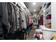 Walk-in closet with hanging clothes, shoe racks, and shelving at 2220 Inwood Landing Ct, Raleigh, NC 27603