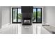 Modern living room with statement fireplace, marble floors, and access to the outdoor deck at 2220 Inwood Landing Ct, Raleigh, NC 27603