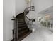 Grand foyer with a spiral staircase, marble flooring, and open views to the dining and living areas at 2220 Inwood Landing Ct, Raleigh, NC 27603