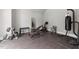Home gym complete with weights, stationary bike, and mirrors for a comprehensive workout space at 2220 Inwood Landing Ct, Raleigh, NC 27603