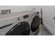 Modern laundry room featuring a Samsung washer and dryer set at 2220 Inwood Landing Ct, Raleigh, NC 27603