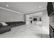 Spacious living room with marble floors opens to a modern kitchen, perfect for entertaining at 2220 Inwood Landing Ct, Raleigh, NC 27603