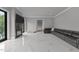 Bright living room features marble floors, a contemporary fireplace, and a large comfortable sectional sofa at 2220 Inwood Landing Ct, Raleigh, NC 27603