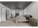 This main bedroom has a gray textured ceiling, carpet and an attached desk area at 2220 Inwood Landing Ct, Raleigh, NC 27603