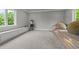 Cozy theater room with tiered seating, a vintage popcorn machine, and built-in storage at 2220 Inwood Landing Ct, Raleigh, NC 27603