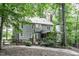 Backyard with partial fence featuring a patio and mature shade trees at 2325 Old Oak Pl, Hillsborough, NC 27278