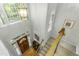 Grand foyer with hardwood floors, staircase, and decorative lighting, creating a welcoming entrance at 2325 Old Oak Pl, Hillsborough, NC 27278